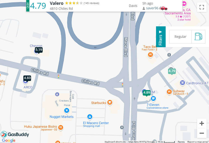 Screenshot of GasBuddy showing 4 gas station locations with their prices